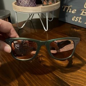 Metallic green Ray-Ban wayfarer sunglasses with a metallic pink colored lens